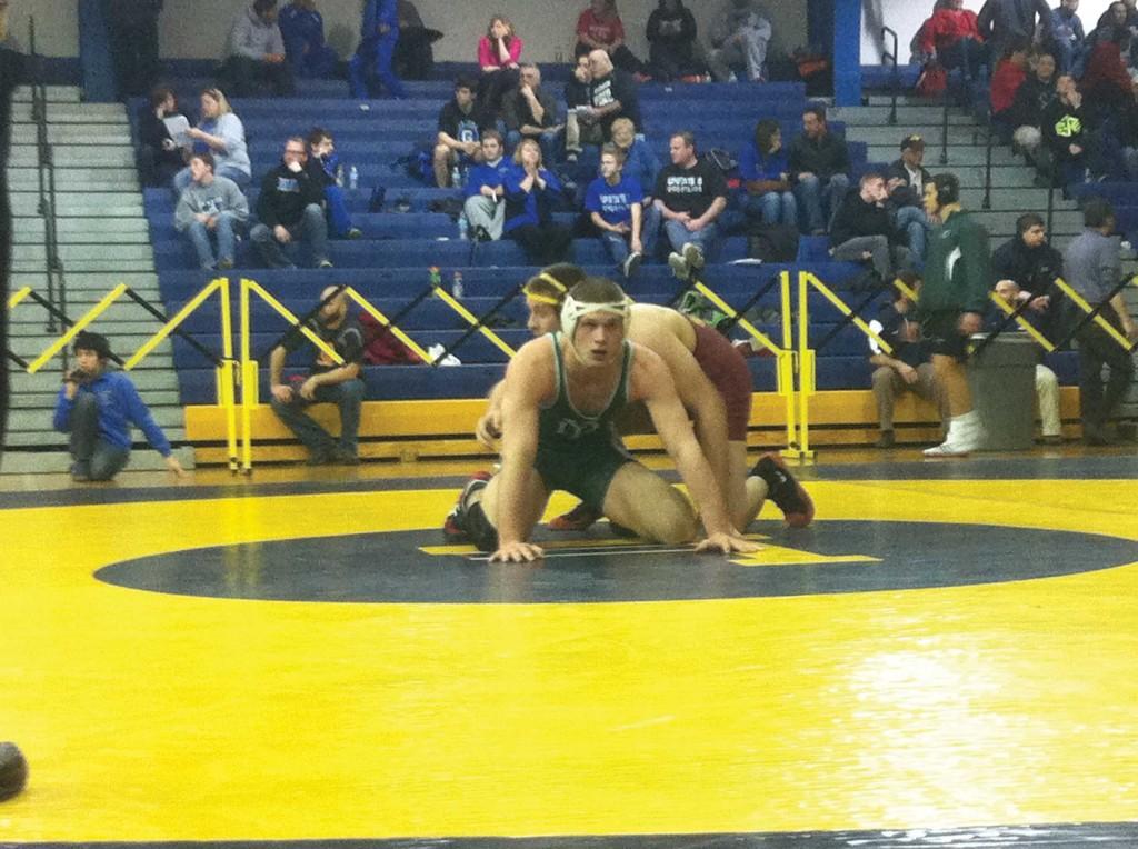 Noah Fleckenstein in a qualifying match for IHSA state tournament.