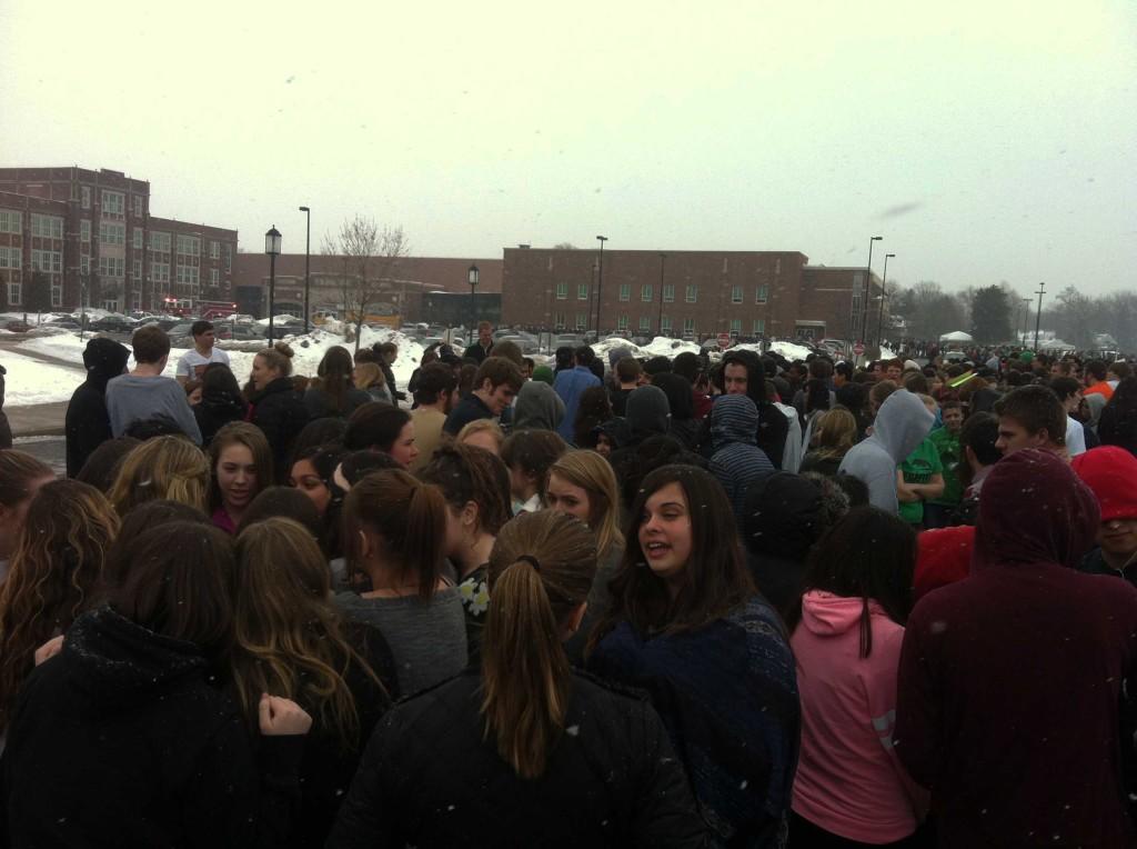 Students huddle up to stay warm during evacuation.