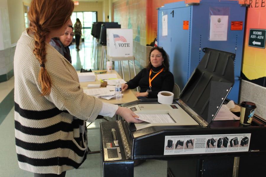 Nora McKenna submits her ballot in the 2014 Mock Election