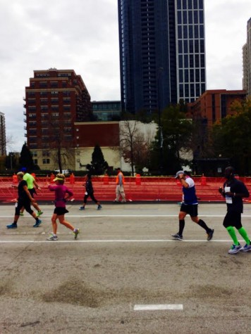 Mr. Gearing, pictured second from right, fist-pumping his way to the finish.