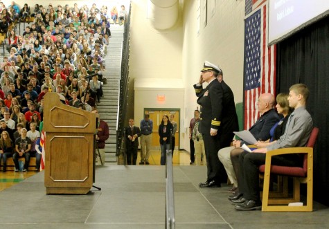 U.S. Commander, Micheal Kerley salutes to his fellow veterans before giving his speech.