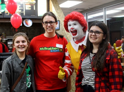 Ms.Carlson and Ronald McDonald taking pictures with fans of McTeacher Night.