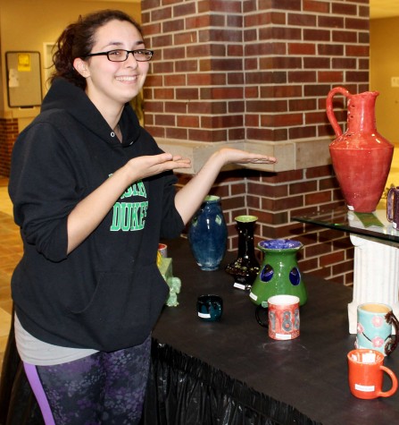 Cheyenne Jaworski obtains a ribbon for honorable mentions for her flower designed ceramic.