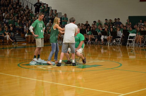 York-hi's own John Petersen, Senior Class Presidents Lydia Faber and Kenny Sidoryk prepare to pie Dean Urbanski.