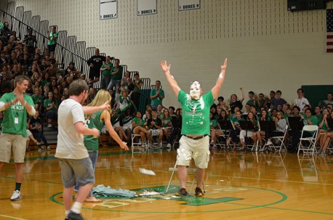 Dean Urbanski celebrates taking a pie to the face.