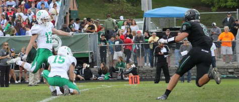 Thomas Morrissey (17) kicks ball for a one point conversion causing the score to become 41-14.