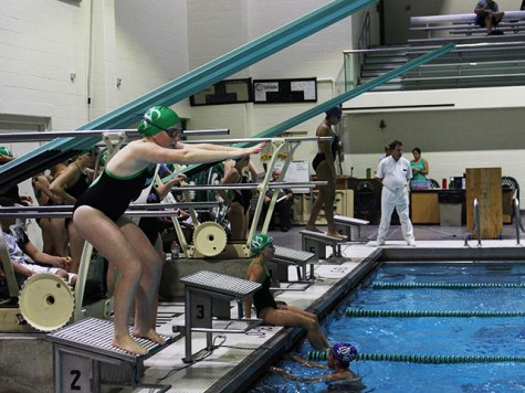 A York swimmer takes a stance to prepare for an exchange during a relay.