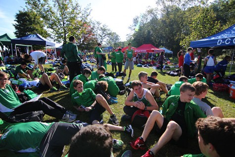 Several team members rest in the team area awaiting their race.