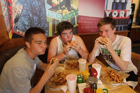 Seniors Josh Hovance, Brennan McGovern and Tim Manning enjoy a "Starting Line" burger after the win.