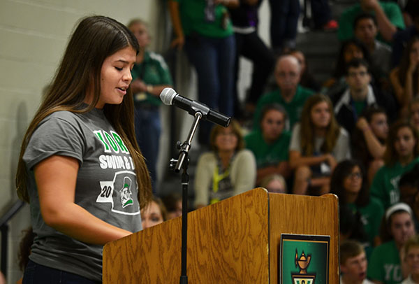 Student Body President Grace Achepol addresses students at the Homecoming Pep Rally.