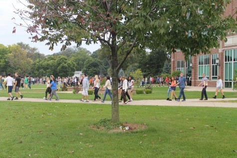 Students evacuate the building during unexpected fire alarm.
