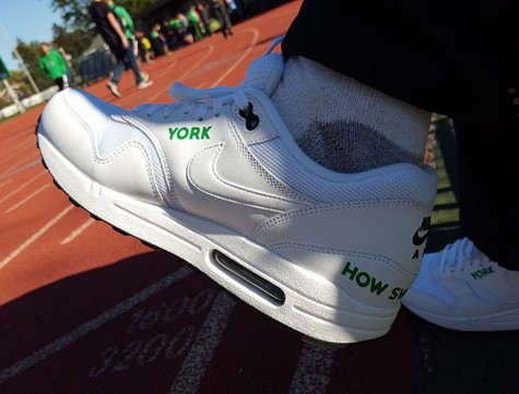 Mr. Newton's custom Nike shoes with his favorite saying "How sweet it is!" on the back.