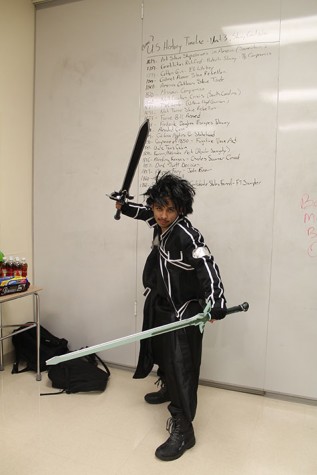 “Michael Melendez, junior, duel welding his swords, and dressed as Kirito from the anime Sword Art Online