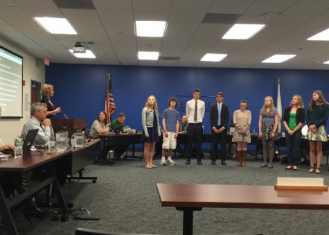 The National Merit Commended Students and Semifinalists are honored at the most recent board meeting.