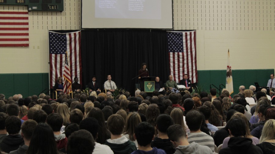 Student leaders speak at veterans day assembly. 