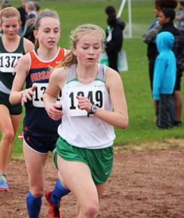 Sophomore Emily Siegenthaler races on varsity to win the Proviso West meet.