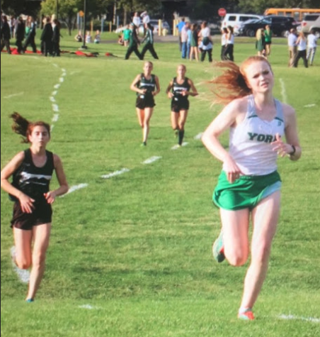 Sophomore Erin Davies beats Glenbard West girls in her race to finish the varsity race.