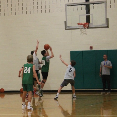 York basketball player goes up for a layup to impress coach at tryouts. 