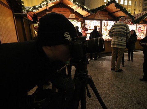 Jake Pardue, senior, frames a shot in the famous Christkindlmarket of Daily Plaza.