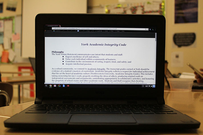 A student views the Academic Integrity policy on their Chromebook.