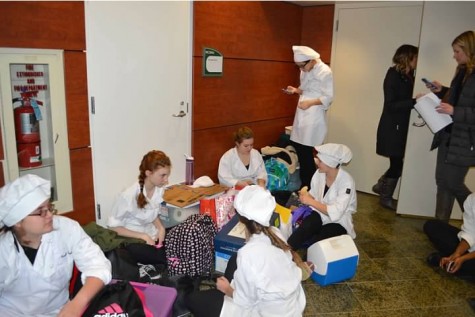 Culinary competitors wait for hours in the hallway until their category is called to present.