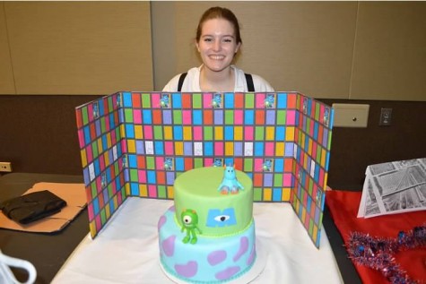 Julianna Gecsey stands confidently after a successful cake presentation to the judges.