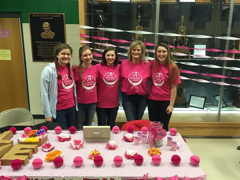 Student Council members sell pink hearts to raise money for the Annie LeGere Foundation. Photo by Madison Collins