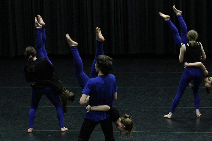 Advanced dance students perform a lift while dancing to David Bowies Fame.