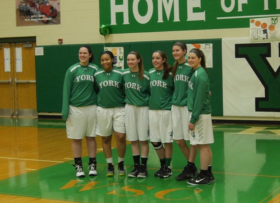 Senior players pose for a picture before the game. 