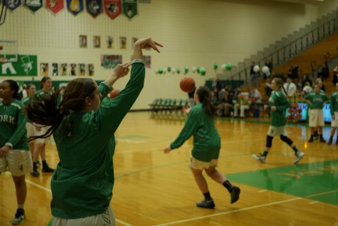 Megan Backman warms up her shot before the game.