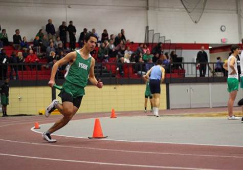Mark Bashqawi, junior, races around the curve in the 4X200m relay.