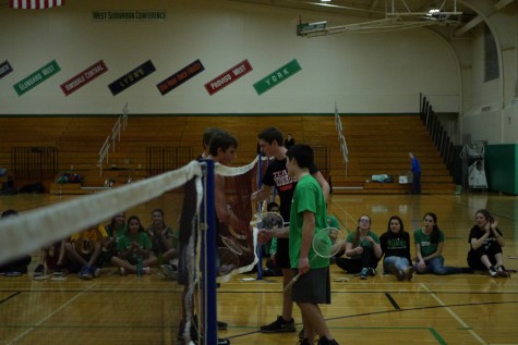 The players of the championship game shake hands after a hard match. 