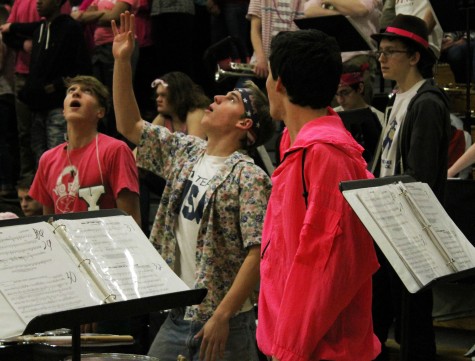 Band students help to pump up the crowd at the basketball game. 