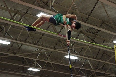 Connor Murphy, senior, clears the bar while pole vaulting. Murphy cleared 13"6' during the Proviso West meet which is one inch short of the qualifying state height. 
