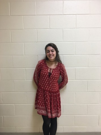 A brightly colored and patterned dress is a great way to make a statement heading into spring (Carina Kanzler, sophomore).