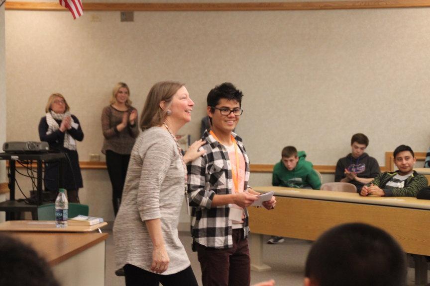 Juan Francisco Sanchez and English 9H teacher Mrs. Loerop sharing a moment when Francisco talks about his experience.