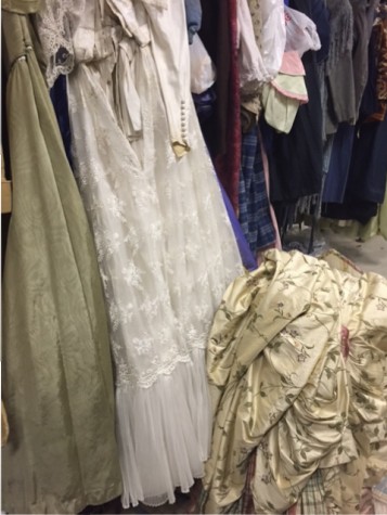 The girl's dressing room is full of a variety of costumes, from rags to riches.
