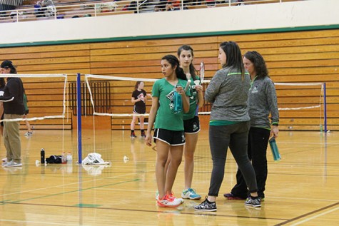 Coaches Young and Bartolai talk with 1st doubles players Irin Abraham and Grace Mazzocco.