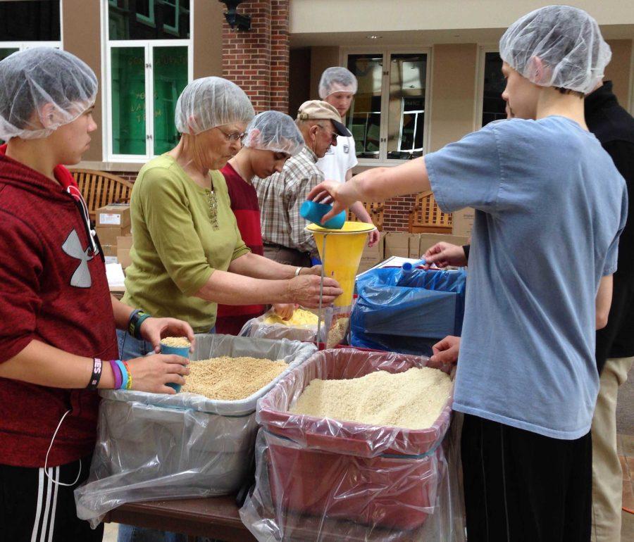 Instead of having lunch, York students and senior citizens are helping the charity organization, Food Fight by packaging food.