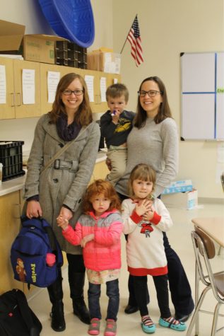 English teachers, Mrs. Riley and Mrs. Bylina, pose with their kids before starting first period.