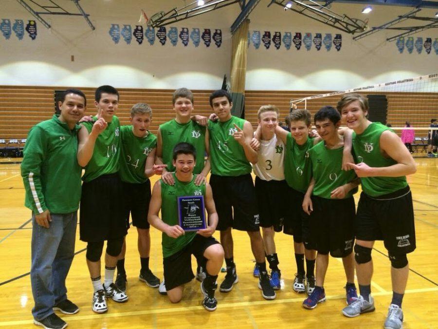 The Freshman A team celebrates their tournament win at Downers Grove South. 