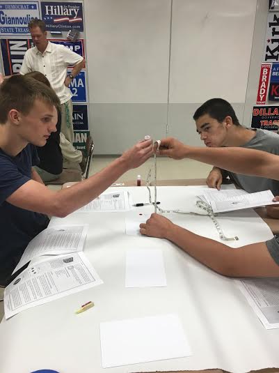 In Mr. Dowdys Criminology class, students Tyler Gorski (left), 16, and Alex Gianneschi (right), 15, are measuring the length between blood droplets.