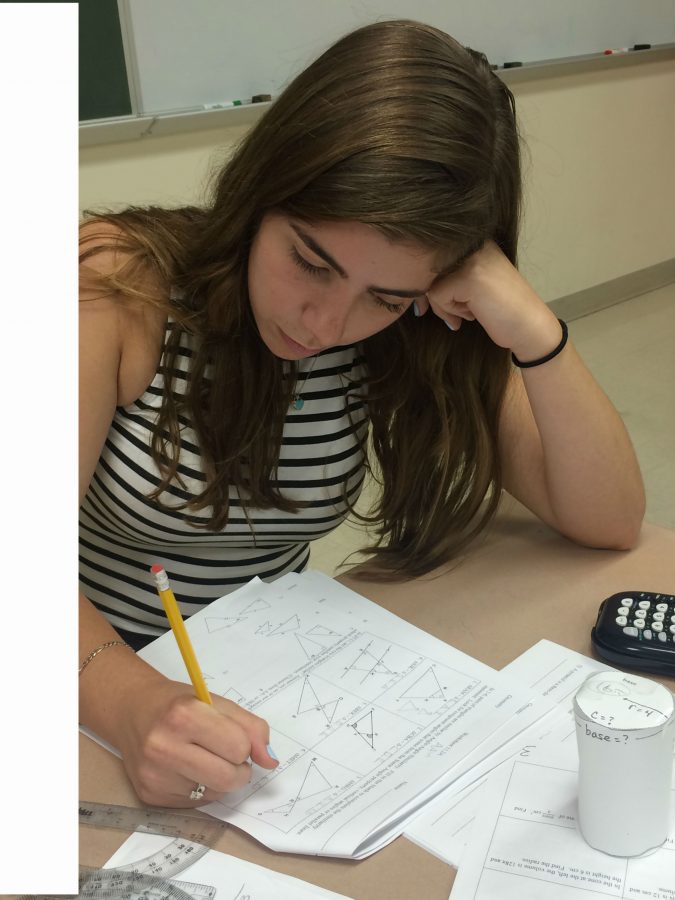 Sophomore Isabelle Downey solves a problem during class.
