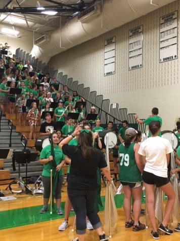 The band prepares to welcome the Class of 2020 with their rendition of "Hey Baby" by Bruce Channel.