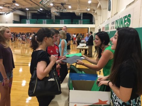 counselors distribute schedules on fresh night