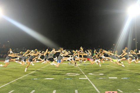 York cheer jumps into the game's halftime show. 