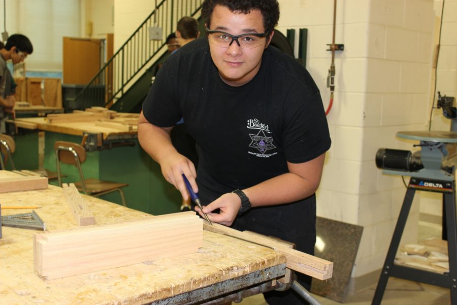 I took this class because I enjoy woodworking and I enjoy working with tools. Right now we are all making different tables. I am making an end table which I am going to put in my family room. Ill probably put a lamp, coffee, and some good books on it. Yeah....I read a lot of books.