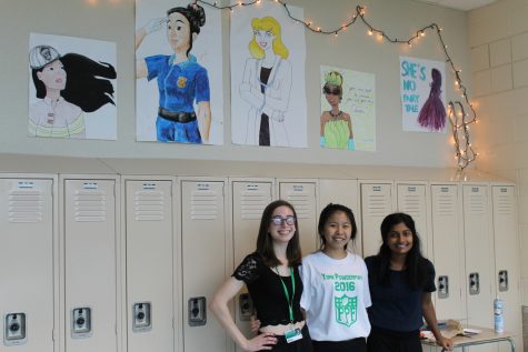 Empower members, Amanda Shafer, senior, Honey Tey, junior, and Jenny Yohannan, sophomore, display their posters of powerful princesses. 
