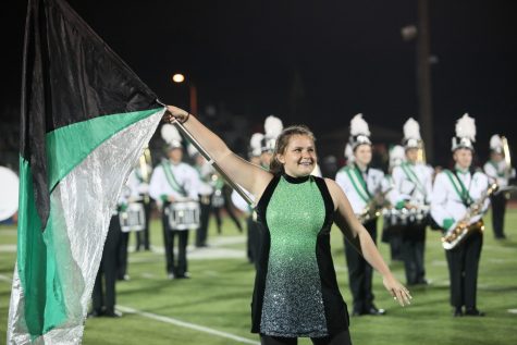 Senior Kathleen Walsh is all smiles after she finished a performance of the second song of the halftime show, "Crazy Little Thing Called Love."