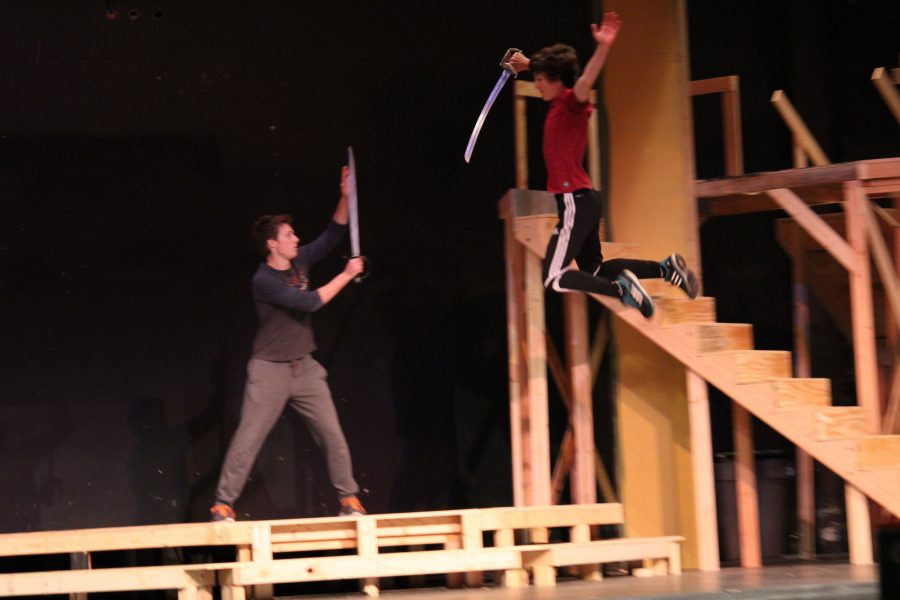 Tybalt, played by junior Sam Griffin lunges at Romeo, played by Erik Martenson (senior) in one of the most heated fights of the show. 